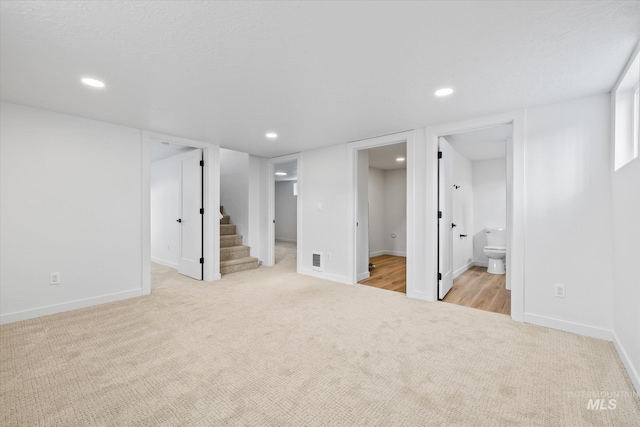 basement with light carpet