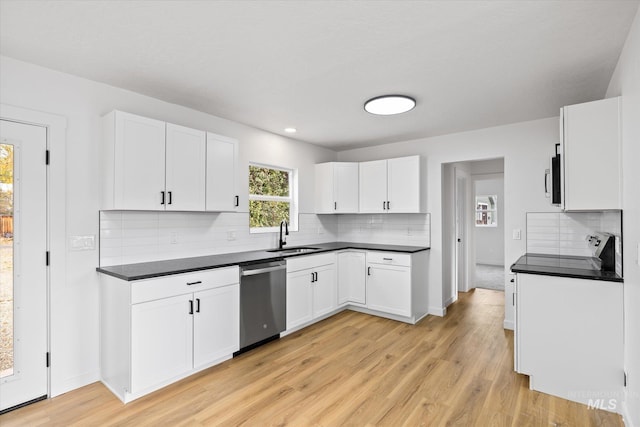 kitchen with sink, white cabinetry, light hardwood / wood-style flooring, and stainless steel appliances