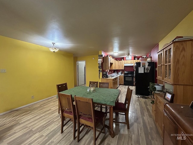 1585 Woodside Rd, Winchester, ID 83555 - dining area with light wood-style floors and baseboards
