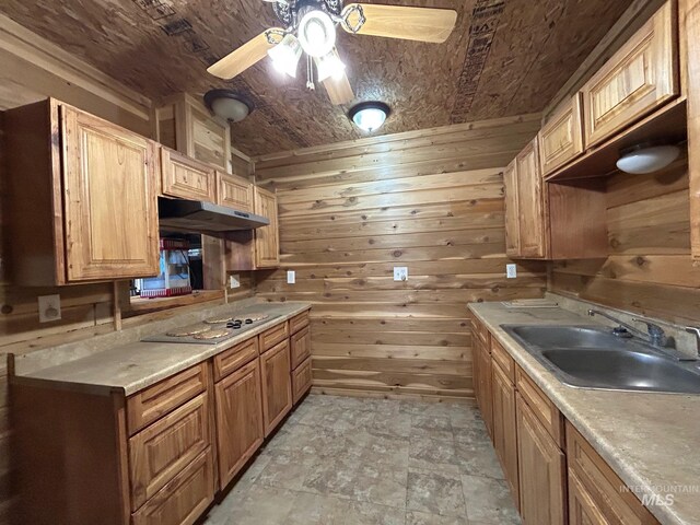 1585 Woodside Rd, Winchester, ID 83555 - kitchen featuring a sink, under cabinet range hood, wooden walls, electric stovetop, and a ceiling fan