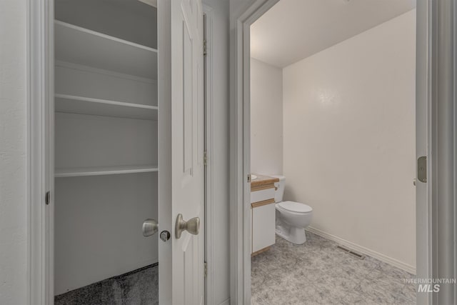 426 S Utah, Fruitland, ID 83619 - bathroom with vanity, toilet, baseboards, and tile patterned floors