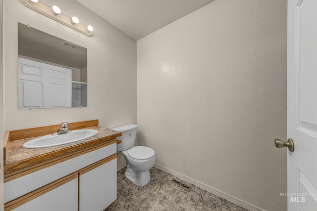 426 S Utah, Fruitland, ID 83619 - bathroom featuring vanity, toilet, and baseboards