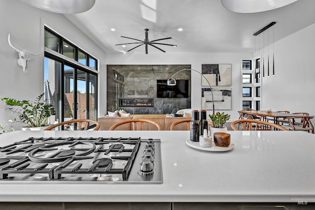 kitchen with recessed lighting, a ceiling fan, and stainless steel gas stovetop