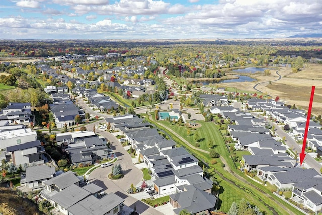 aerial view with a water view and a residential view