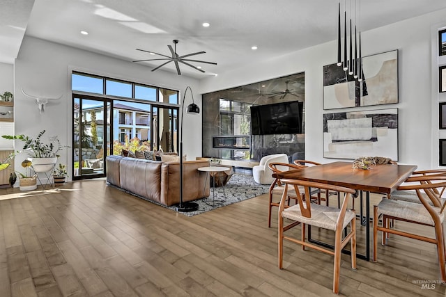 living room featuring recessed lighting, wood finished floors, and ceiling fan