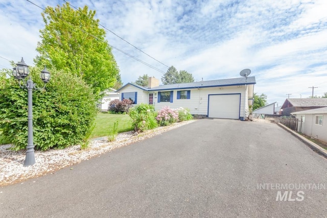 404 Linden Dr, Lewiston, ID 83501 - ranch-style house with a garage, driveway, and a chimney