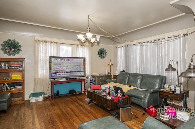 living room with dark hardwood / wood-style flooring and a chandelier