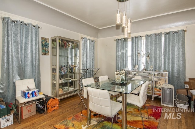 dining space featuring wood-type flooring