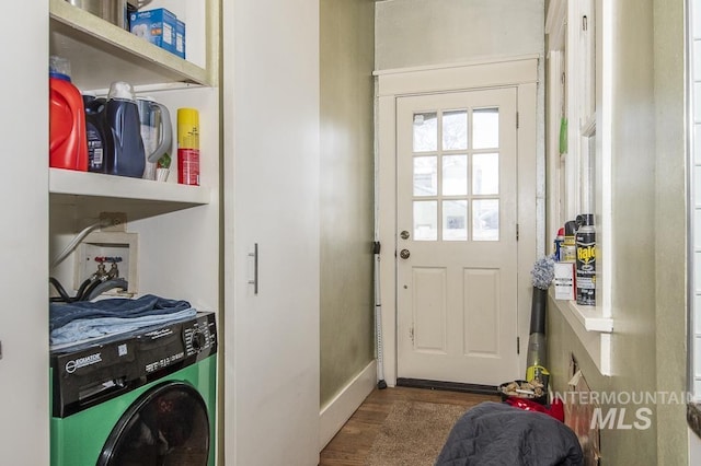 washroom featuring washer / dryer and dark hardwood / wood-style floors