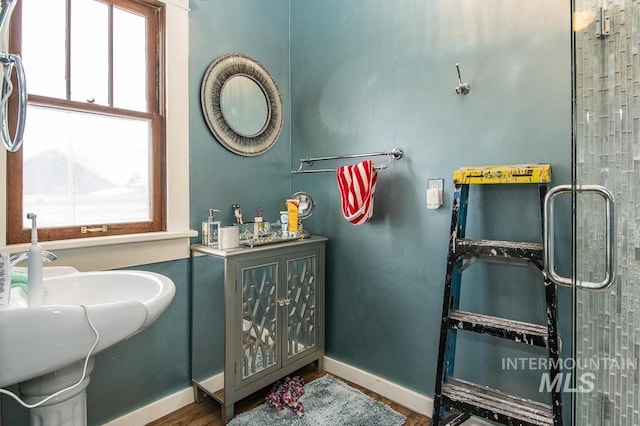 bathroom with hardwood / wood-style floors