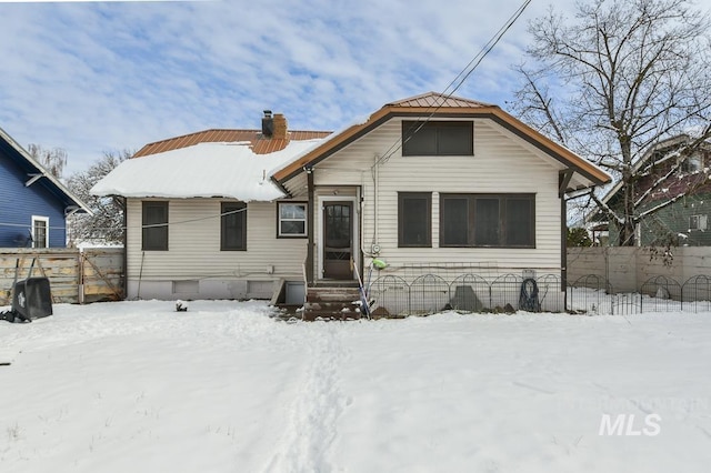 view of snow covered house