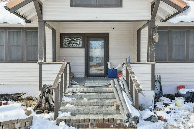 view of snow covered property entrance