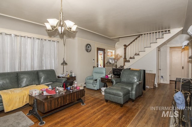 living room with an inviting chandelier and wood-type flooring