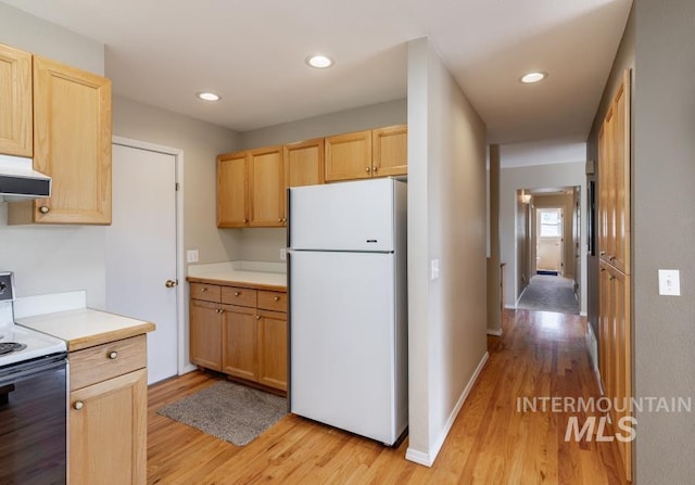 943 Colt Rd, Moscow, ID 83843 - kitchen featuring white appliances, exhaust hood, light wood-type flooring, light brown cabinetry, and recessed lighting