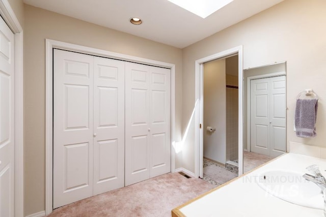 943 Colt Rd, Moscow, ID 83843 - bedroom featuring light colored carpet, a sink, a closet, baseboards, and recessed lighting