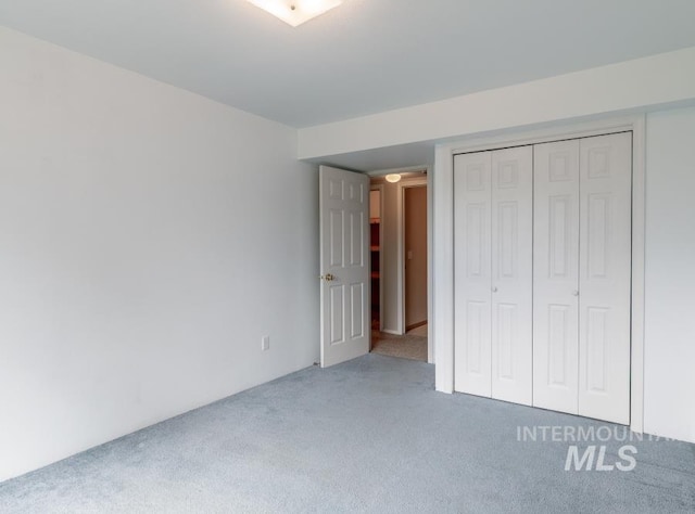 943 Colt Rd, Moscow, ID 83843 - unfurnished bedroom with carpet flooring and a closet