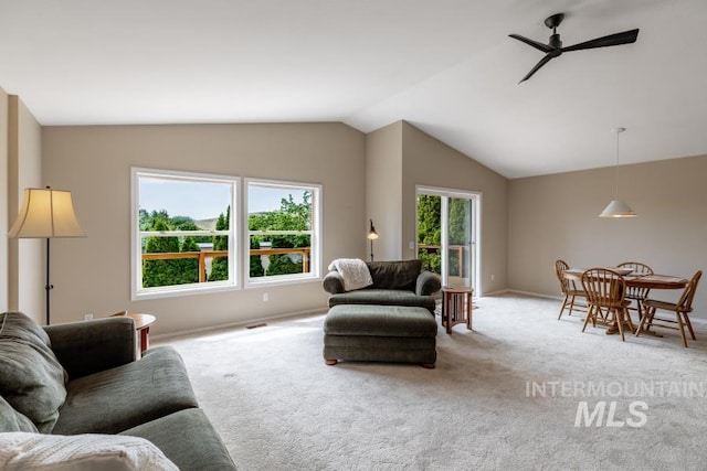 943 Colt Rd, Moscow, ID 83843 - living room featuring vaulted ceiling, carpet flooring, a ceiling fan, and baseboards