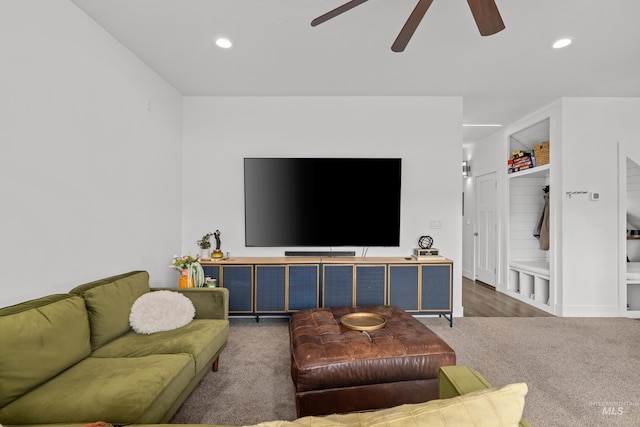 living room with a ceiling fan, recessed lighting, and carpet