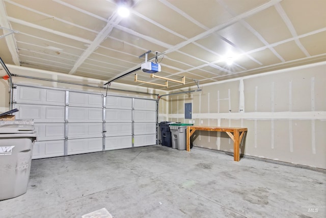 garage with electric panel and a garage door opener