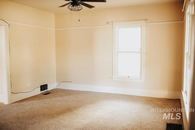 empty room with carpet floors and ceiling fan
