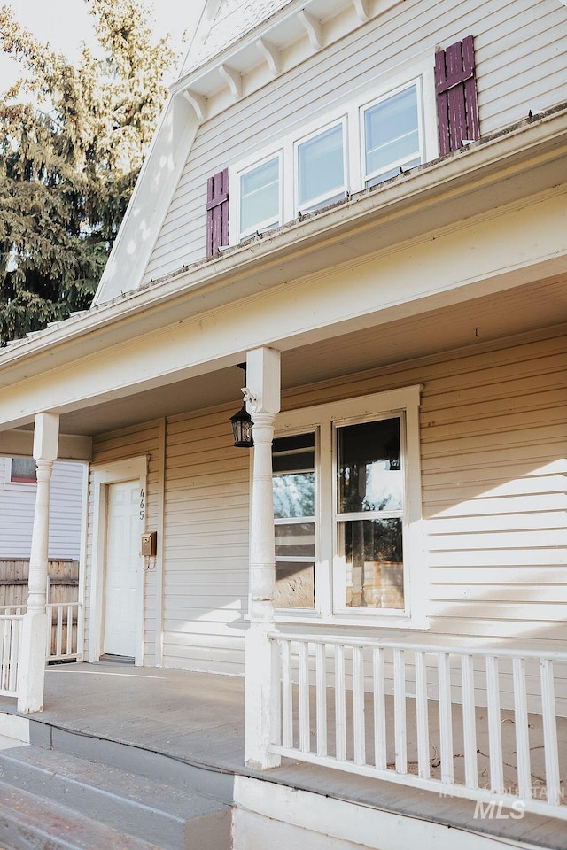 view of exterior entry with covered porch