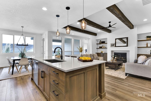 2493 E Galleon Ln, Meridian, ID 83642 - kitchen with a sink, wood finished floors, light countertops, a ceiling fan, and beamed ceiling