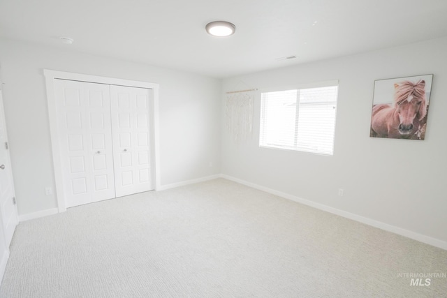 6073 W Mikonos St, Meridian, ID 83646 - unfurnished bedroom featuring carpet flooring, a closet, and baseboards
