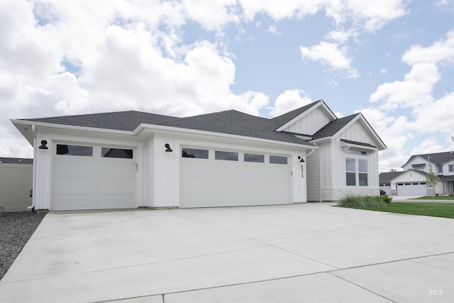 6073 W Mikonos St, Meridian, ID 83646 - modern farmhouse with board and batten siding, an attached garage, concrete driveway, roof with shingles, and stone siding