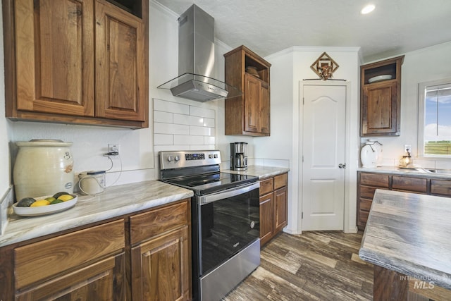 kitchen with extractor fan, dark wood-style flooring, electric stove, ornamental molding, and light countertops