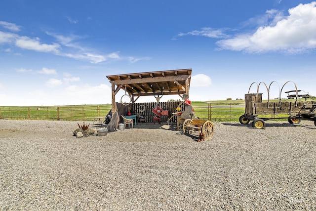 view of jungle gym featuring a rural view