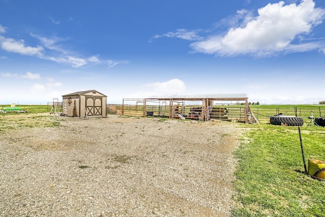 view of outdoor structure featuring an outbuilding, a rural view, and an exterior structure