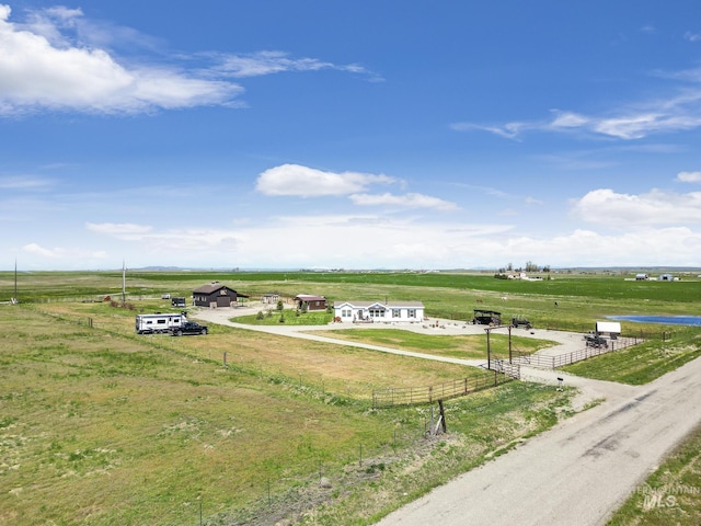 birds eye view of property with a rural view