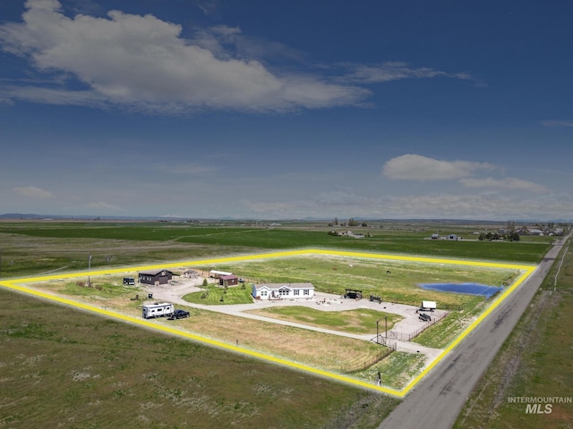 birds eye view of property featuring a rural view