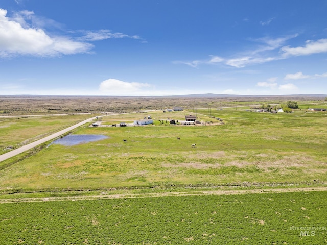 birds eye view of property with a rural view