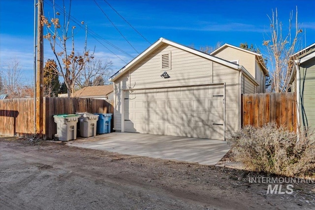 garage with fence