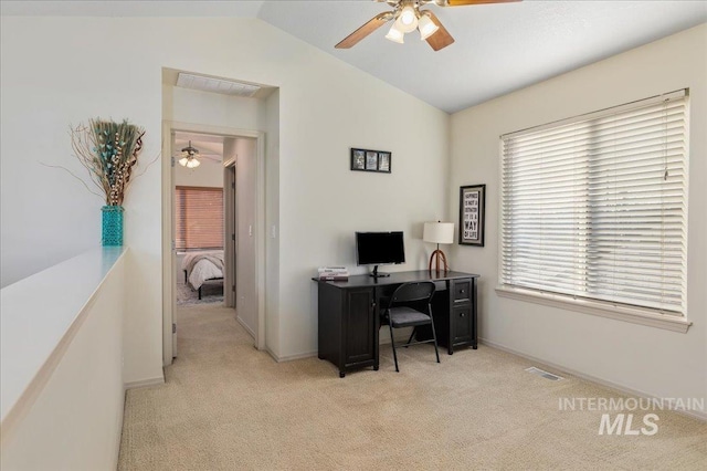 carpeted office featuring plenty of natural light, ceiling fan, visible vents, and lofted ceiling