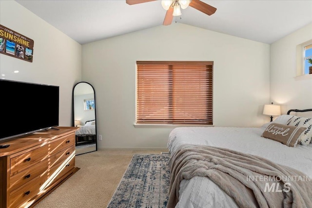 bedroom with baseboards, ceiling fan, carpet flooring, and lofted ceiling