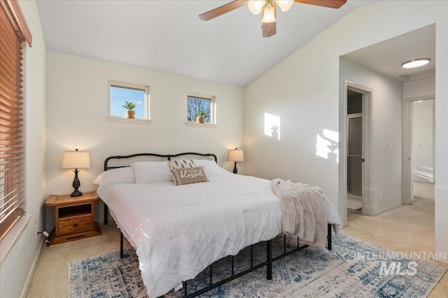 bedroom featuring baseboards, carpet flooring, a ceiling fan, and lofted ceiling