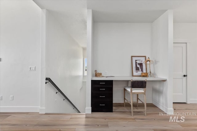 office space with light hardwood / wood-style flooring