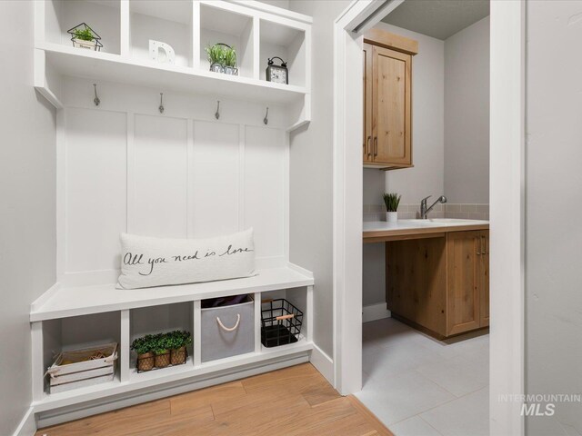 mudroom with a sink