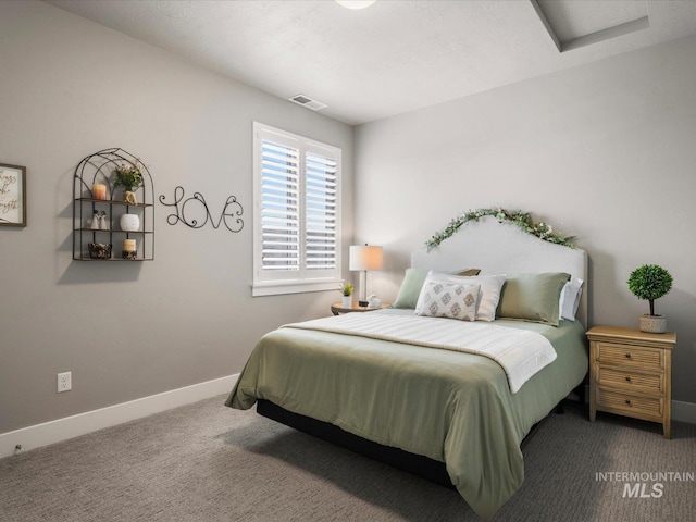 bedroom with carpet, baseboards, and attic access