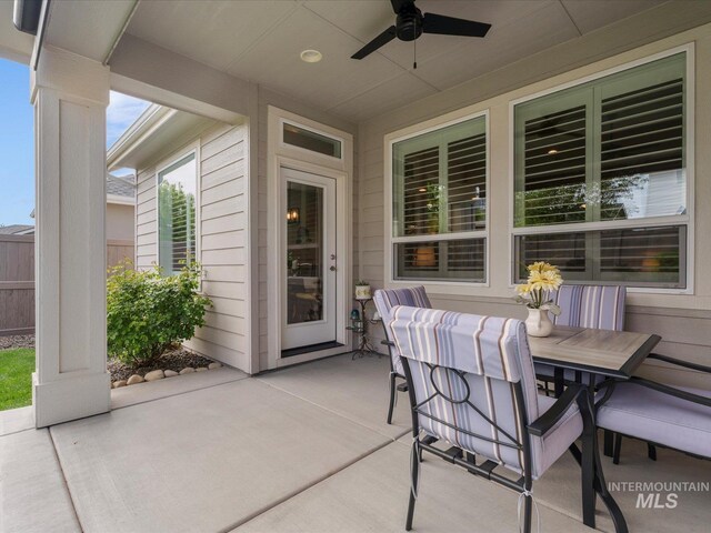 view of patio featuring outdoor dining space and a ceiling fan