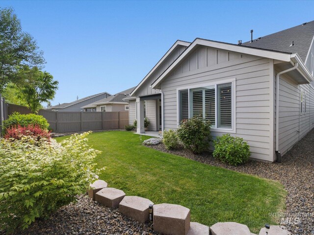 rear view of house with board and batten siding