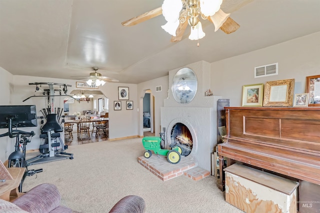 interior space with ceiling fan and carpet