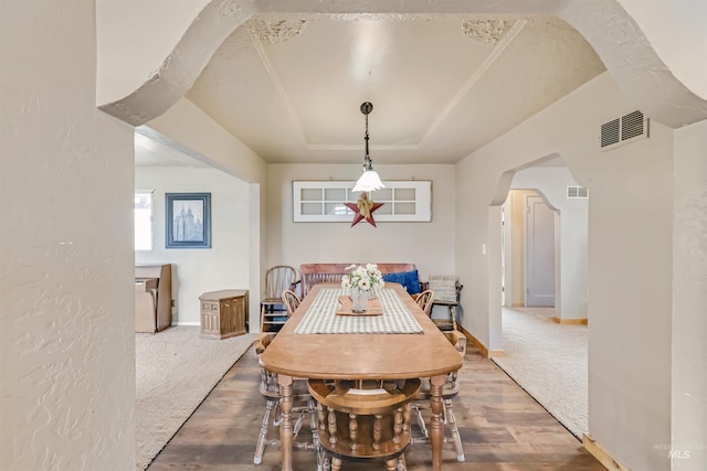 dining area with hardwood / wood-style floors