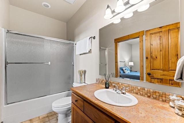 bathroom with bath / shower combo with glass door, decorative backsplash, connected bathroom, toilet, and vanity