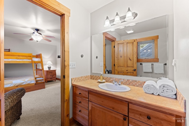 bathroom with ceiling fan, tasteful backsplash, and vanity