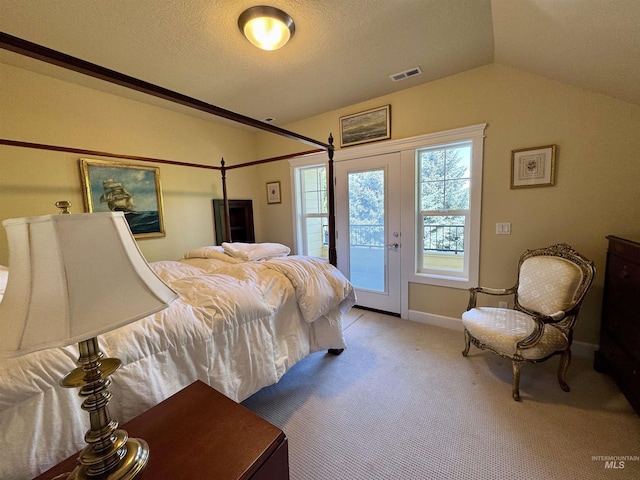 bedroom featuring visible vents, baseboards, lofted ceiling, access to outside, and light carpet