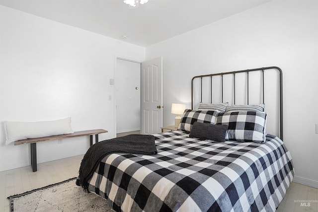 bedroom featuring baseboards