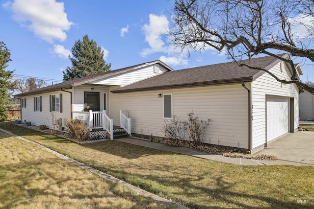 ranch-style home with a front yard, concrete driveway, a garage, and a shingled roof